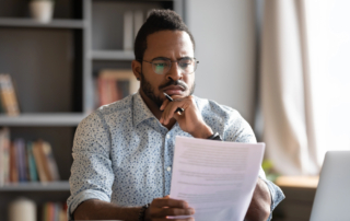Man looking over estate documents
